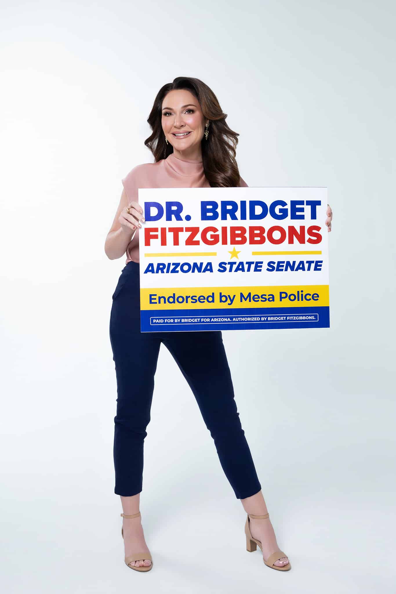Bridget Fitzgibbons with campaign sign standing